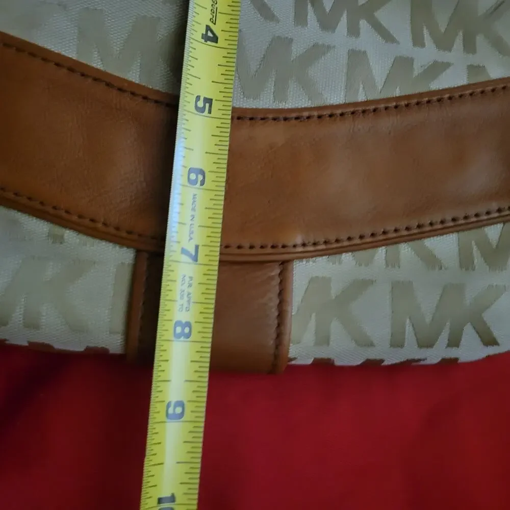 Michael Kors Jamesport Signature Handbag Tab with Leather and Gold Trim Striking